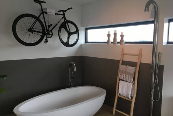 Hang your bike on the wall in the bathroom